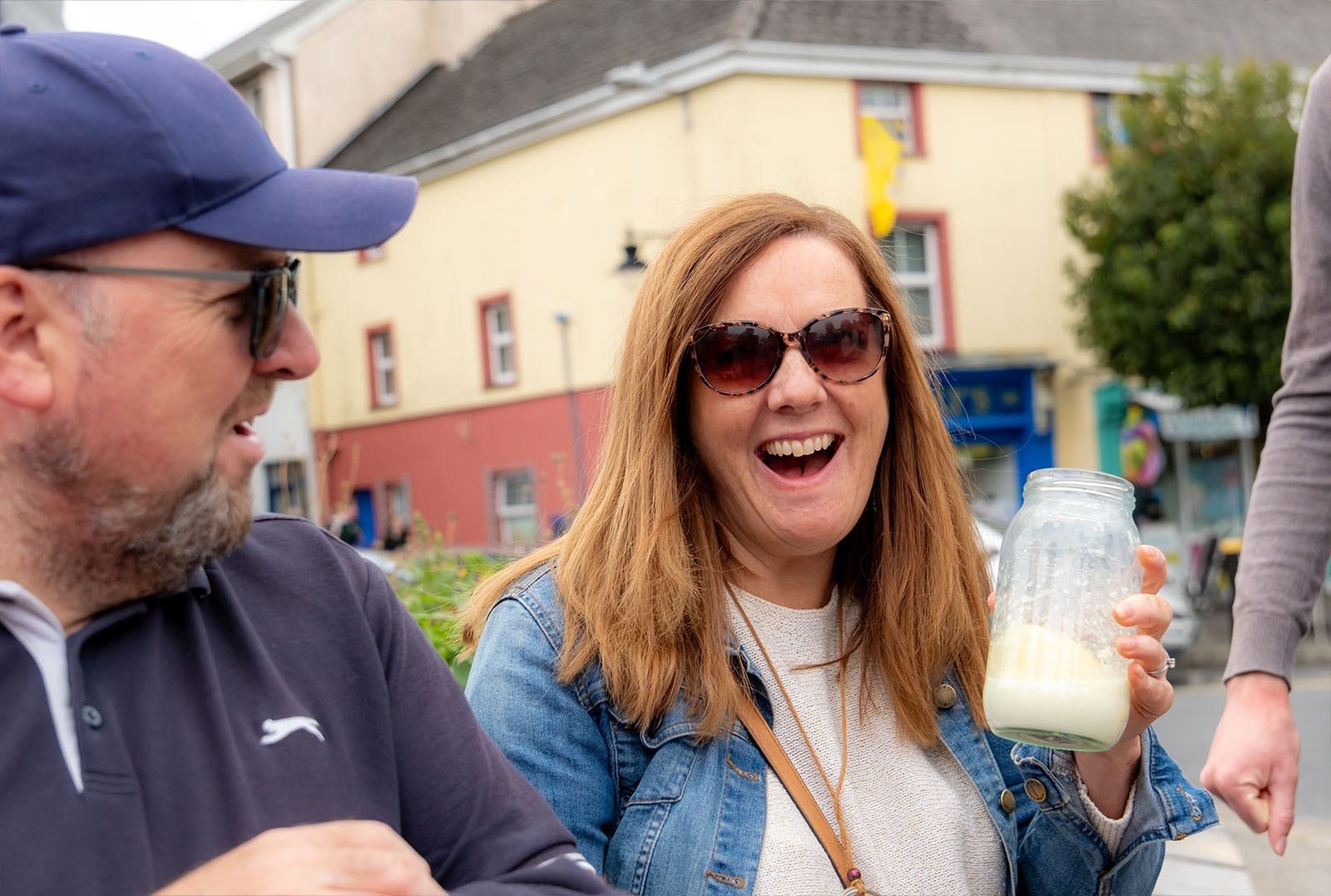 Tour member with jar of curds