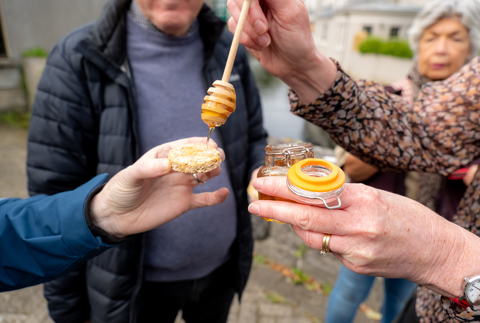 Dripping honey on ricecake close-up