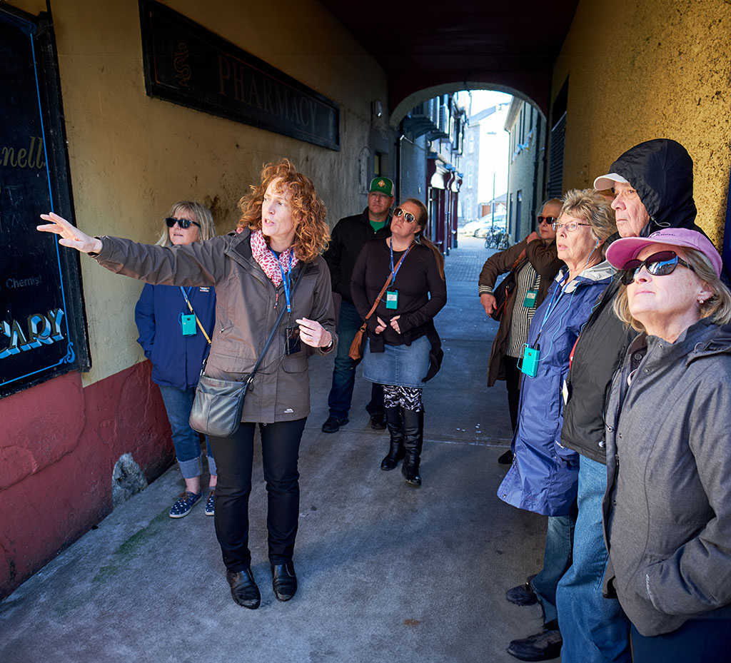 Jane with tour group in alleyway